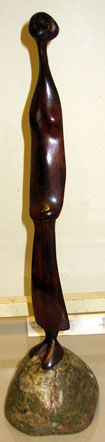 Lucas SITHOLE LS7551 "But why?", 1975 - wild olive wood on liquid steel base - 40cm H incl. base